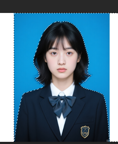 用魔棒工具点击图像的纯色背景区域，会自动选择背景区域