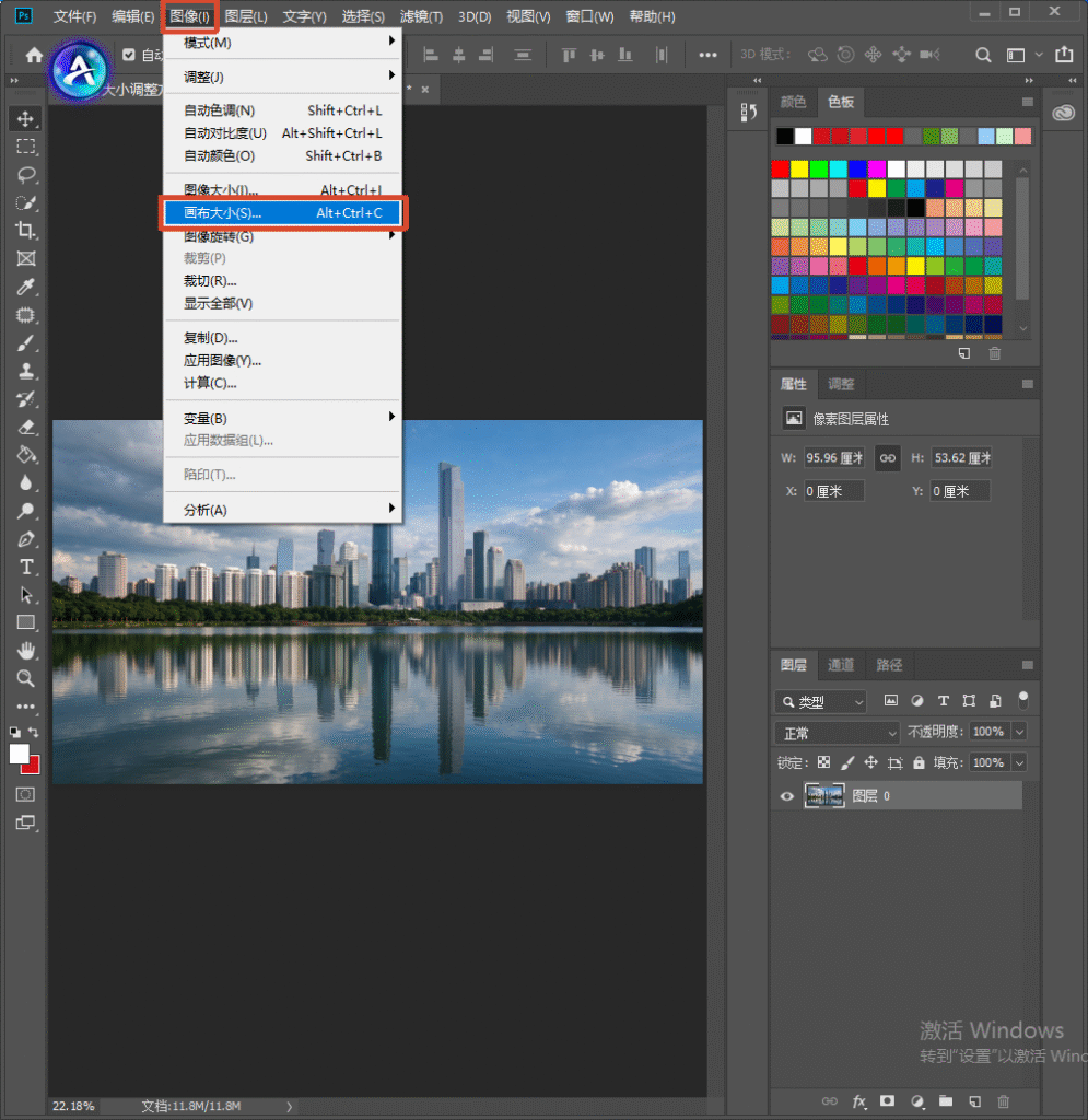 Photoshop 软件界面，顶部图像菜单展开，高亮选中【画布大小】选项，快捷键 Alt+Ctrl+C，画布内是城市湖景素材
